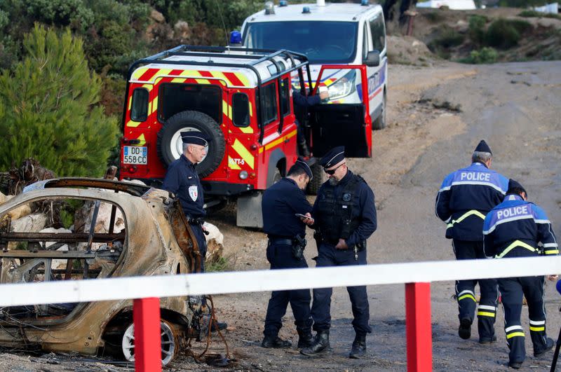 French police secure the area around the site where a helicopter from the civil security services crashed near Marseille