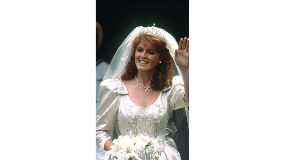 Sarah Ferguson in wedding dress waving 