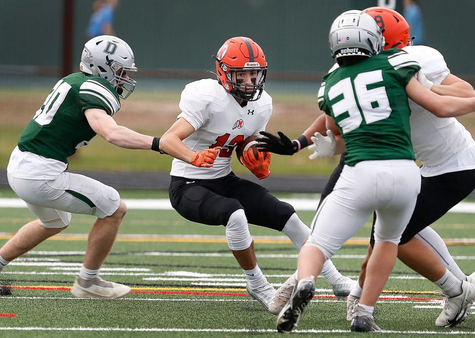 Middleboro receiver Justin Mather looks to get into a hole in the line.The Duxbury Dragons hosted the Middleboro Sachems in MIAA football tournament action on Friday November 11, 2022.