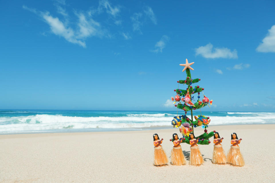 Hula Dancers and Christmas Tree in Tropical Hawaiian Beach Hz (YinYang / Getty Images)