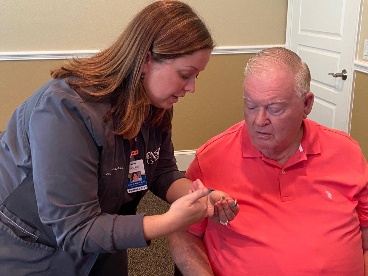 Dr. Kayla Wilkins works with John Vickery, 78, who has both age-related hearing loss and unexplained sudden loss in one ear.