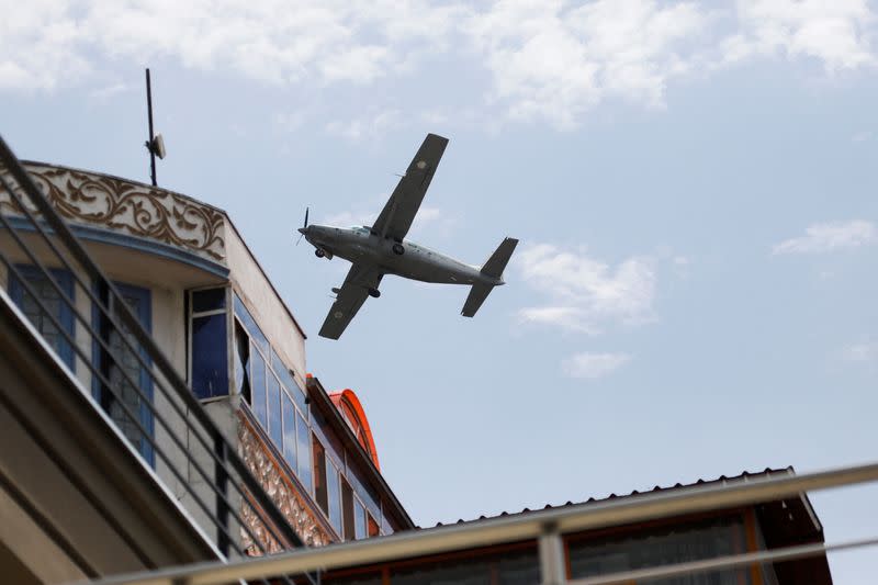 A Taliban Air Force plane flies over Kabul