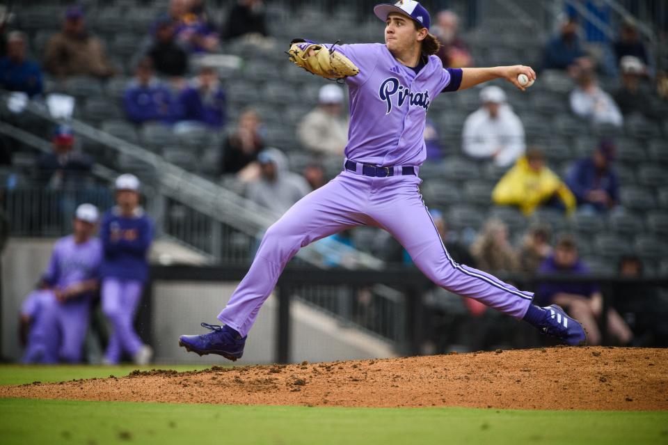 East Carolina's Zach Root winds up a pitch for a Campbell batter during the first inning on Wednesday, March 22, 2023, at Segra Stadium.