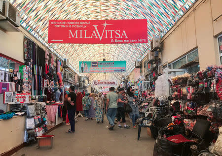 Customers walk inside Abu Sahiy, a wholesale market near Tashkent, Uzbekistan June 13, 2018. Picture taken June 13, 2018. REUTERS/Stringer