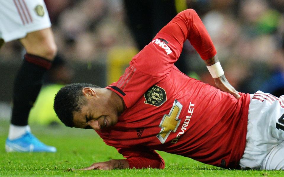 Marcus Rashford picked up a back injury against Wolves in the FA Cup - REX