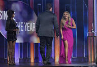 Martina McBride, from left, presents Lee Brice and Carly Pearce with the award for single of the year for "I Hope You're Happy Now"at the 56th annual Academy of Country Music Awards on Sunday, April 18, 2021, at the Grand Ole Opry in Nashville, Tenn. (AP Photo/Mark Humphrey)