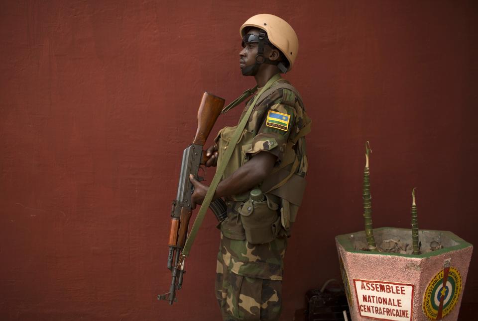 A Rwandan AU peacekeeper stands guard during parliamentary elections at the national assembly in Bangui