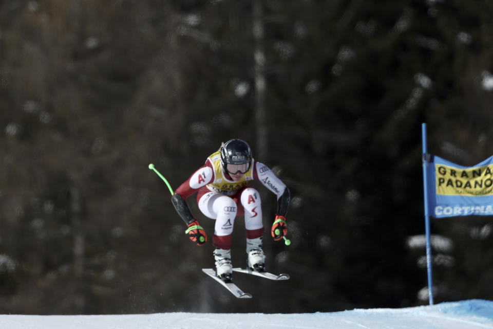 Austria's Cornelia Huetter speeds down the course during an alpine ski, women's World Cup super-G, in Cortina d'Ampezzo, Italy, Sunday, Jan. 22, 2023. (AP Photo/Gabriele Facciotti)