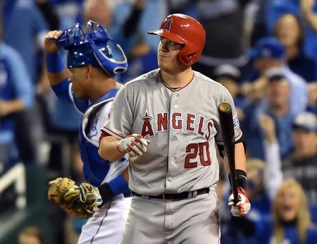 Oct 5, 2014; Kansas City, MO, USA; Los Angeles Angels designated hitter C.J. Cron (20) reacts to striking out against the Kansas City Royals during the fourth inning in game three of the 2014 ALDS baseball playoff game at Kauffman Stadium. Mandatory Credit: Peter G. Aiken-USA TODAY Sports