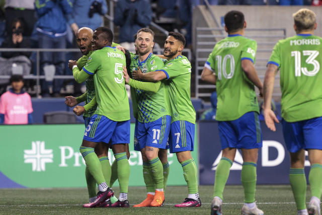 Seattle Sounders forward Heber, left, celebrates his goal with Nouhou Tolo, Albert Rusnak and Cristian Roldan during the second half of the team's MLS soccer match against Real Salt Lake on Saturday, March 4, 2023, in Seattle. The Sounders won 2-0. (AP Photo/Jason Redmond)