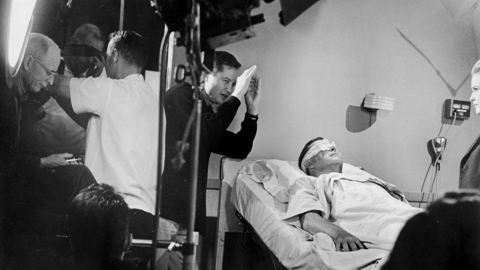 Roger Corman (center) and actor Ray Milland (left) on the set of 'X: The Man with the X-Ray Eyes' in 1963. - Hulton Archive/Getty Images