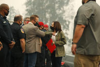 Democratic vice presidential candidate Sen. Kamala Harris, D-Calif., bumps elbows with Fresno County Board of Supervisor, Nathan Magsig, before she was briefed on the Creek Fire at Pine Ridge Elementary, Tuesday, Sept. 15, 2020 in Auberry, Calif. (AP Photo/Gary Kazanjian)