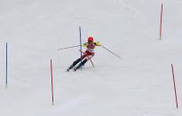 Canada's Marie-Michele Gagnon clears a pole as she competes in the first run of the women's alpine skiing slalom event during the 2014 Sochi Winter Olympics at the Rosa Khutor Alpine Center February 21, 2014. REUTERS/Stefano Rellandini (RUSSIA - Tags: SPORT OLYMPICS SPORT SKIING)