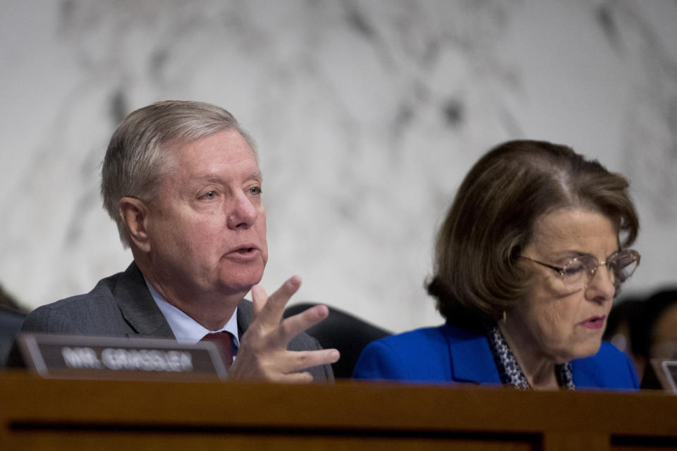 Senate Judiciary Committee Chairman Lindsey Graham, R-S.C., accompanied by Ranking Member Sen. Dianne Feinstein, D-Calif., right, questions Attorney General nominee William Barr during a Senate Judiciary Committee hearing on Capitol Hill in Washington, Tuesday, Jan. 15, 2019. Barr will face questions from the Senate Judiciary Committee on Tuesday about his relationship with Trump, his views on executive powers and whether he can fairly oversee the special counsel's Russia investigation. Barr served as attorney general under George H.W. Bush. (AP Photo/Andrew Harnik)