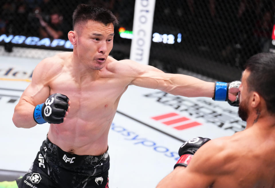 LAS VEGAS, NEVADA – OCTOBER 14: (L-R) Alatengheili of China punches Chris Gutierrez in a bantamweight fight during the UFC Fight Night event at UFC APEX on October 14, 2023 in Las Vegas, Nevada. (Photo by Chris Unger/Zuffa LLC via Getty Images)