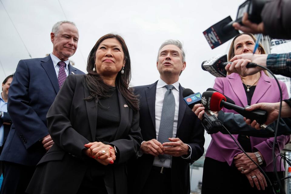 From left, Brad Wieferich, director of MDOT, Mary Ng, Canadian Minister of Export Promotion, International Trade and Economic Development, François-Philippe Champagne, Canadian Minister of Innovation, Science and Industry and Kirsten Hillman, Canada’s Ambassador to the United States, speak to media members under the Gordie Howe International Bridge in Detroit on Tuesday, March 5, 2024.