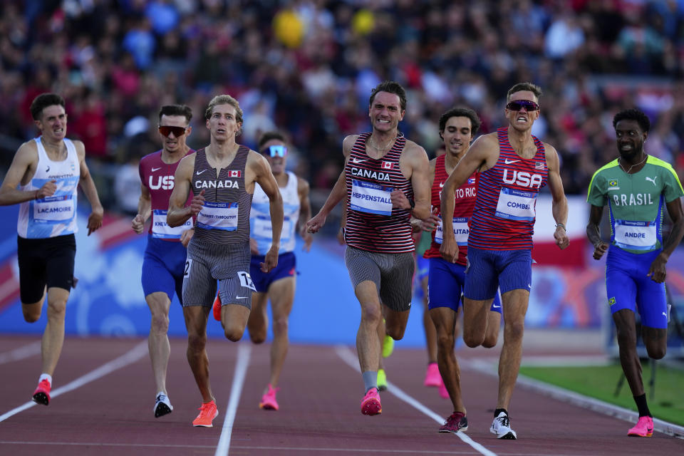 Canada's Charles Philibert-Thiboutot, Canada's Robert Heppenstall and Casey Comber of the United States run in the men's 1500-meters final at the Pan American Games in Santiago, Chile, Thursday, Nov. 2, 2023. (AP Photo/Natacha Pisarenko)