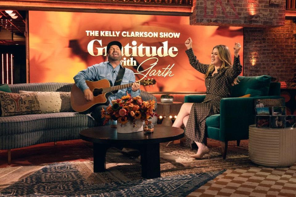 Garth Brooks, left, and host Kelly Clarkson appear on "The Kelly Clarkson Show" on Nov. 20, 2023.