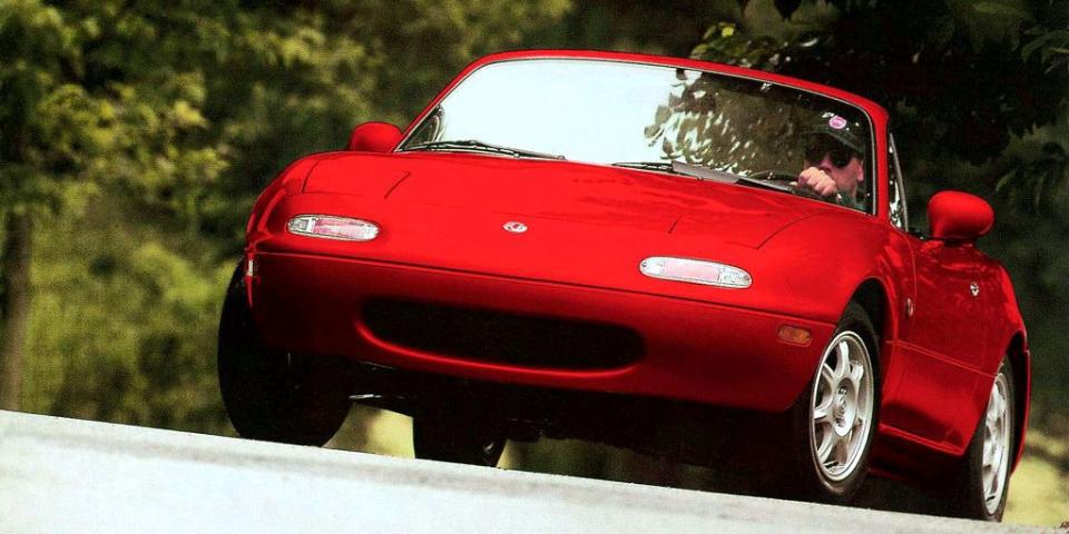 <p>Keeping as closely to the fun to drive philosophy as possible, the Mazda Miata of the 90s was <a href="http://www.caranddriver.com/reviews/1990-mazda-mx-5-miata-archived-test-review" rel="nofollow noopener" target="_blank" data-ylk="slk:handsome and great to drive.;elm:context_link;itc:0;sec:content-canvas" class="link ">handsome and great to drive.</a></p>