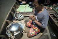 62-year-old Bhoomin Samang is part of a small community known as Thailand's "Indiana Jones" divers, who brave the inky-black underworld of the trash-filled waterway in search of coins, china, jewellery and scrap metal