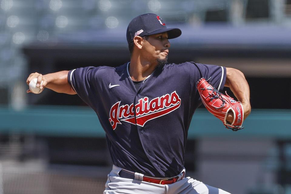 Cleveland Indians starting pitcher Carlos Carrasco delivers during baseball practice, Monday, July 6, 2020, in Cleveland. (AP Photo/Ron Schwane)