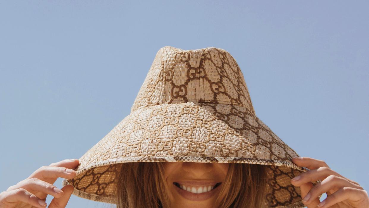 woman wearing a gucci sun hat