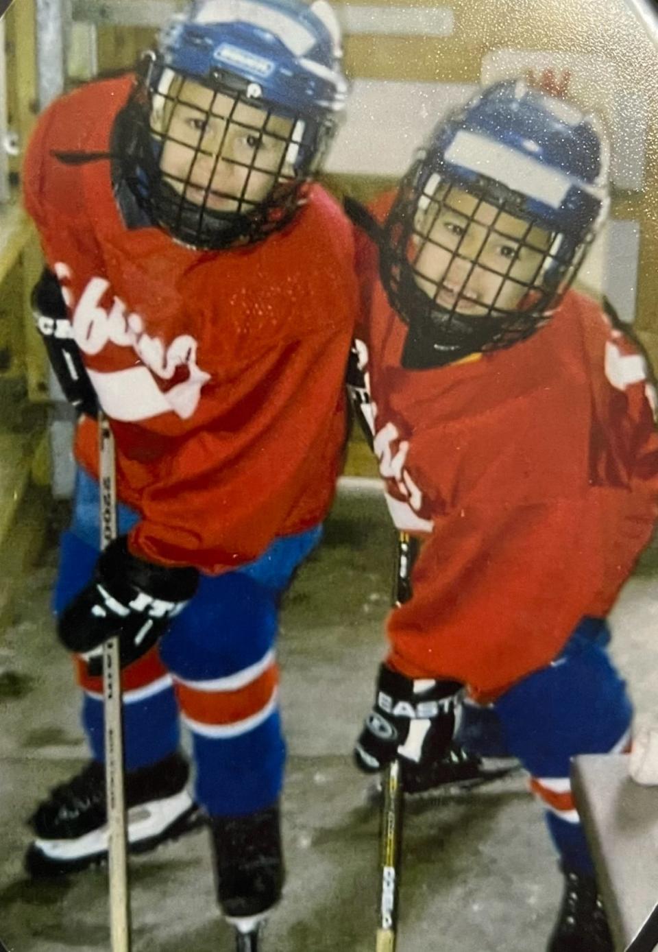 Nathan Latu, left, and twin brother Cameron grew up playing hockey and a variety of other sports in Minnesota before moving to Utah for their teenage years.