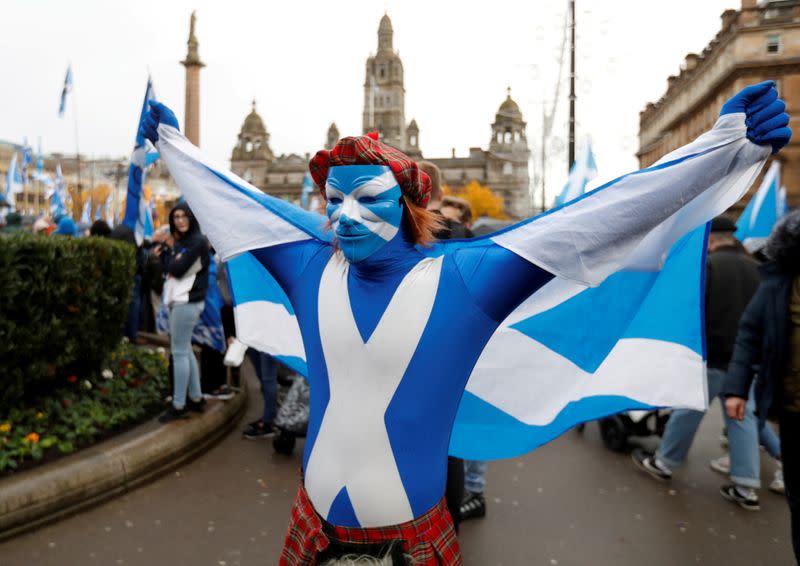 FILE PHOTO: A demonstrator holds a flag during a pro-Scottish Independence rally in Glasgow, Scotland, November 2