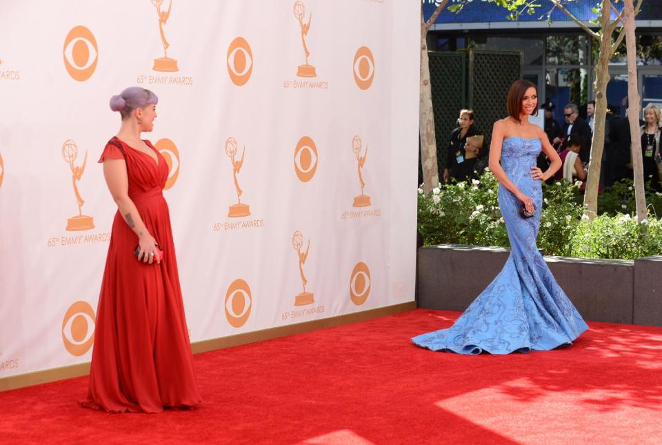 Kelly Osbourne and Giuliana Rancic arrive at the 65th Primetime Emmy Awards at Nokia Theatre on Sunday, Sept. 22, 2013, in Los Angeles. (Photo by Jordan Strauss/Invision/AP)