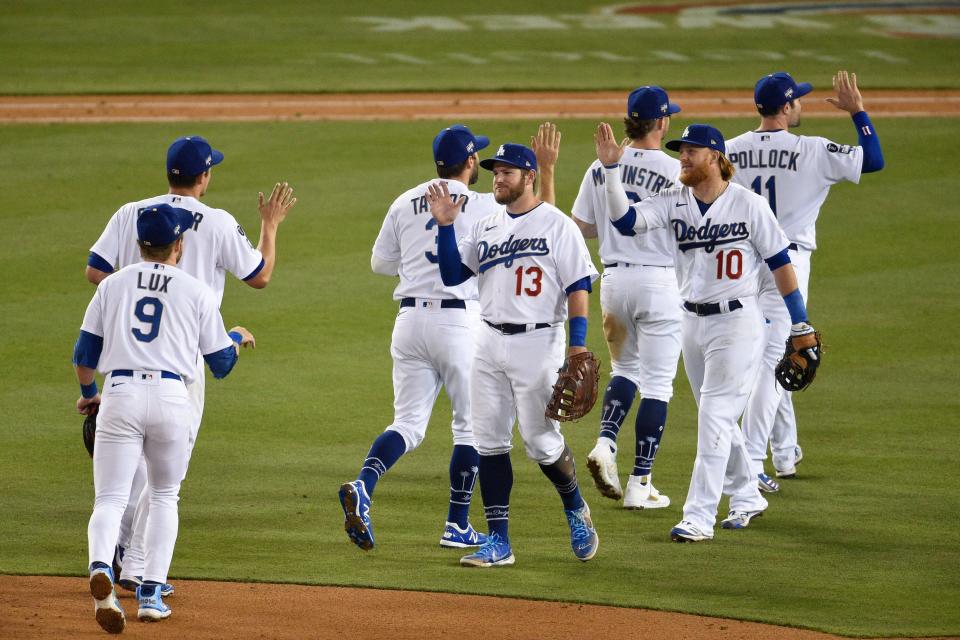 The Los Angeles Dodgers celebrate their 9-5 win against the Washington Nationals at Dodger Stadium on Saturday.