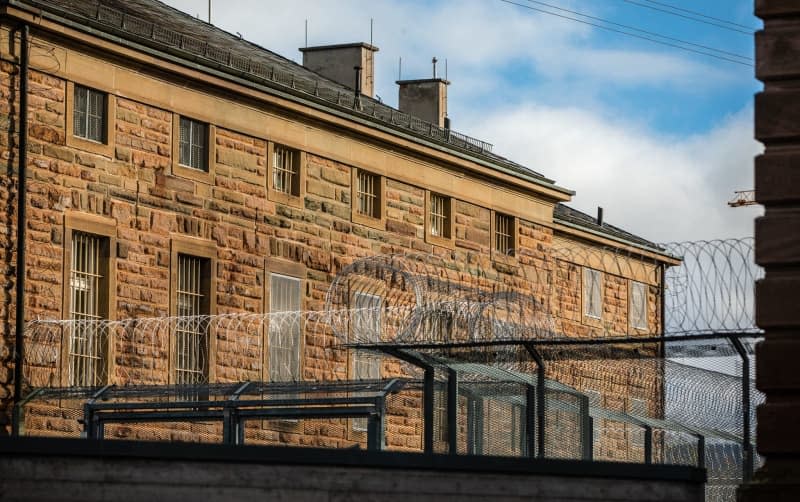 Clouds gather over Hechingen prison. A criminal trial of the alleged ringleaders of a plot to overthrow the German government by far-right extremists in the so-called "Reich Citizens" scene will begin on May 21 in Frankfurt, the court announced on Tuesday. Christoph Schmidt/dpa