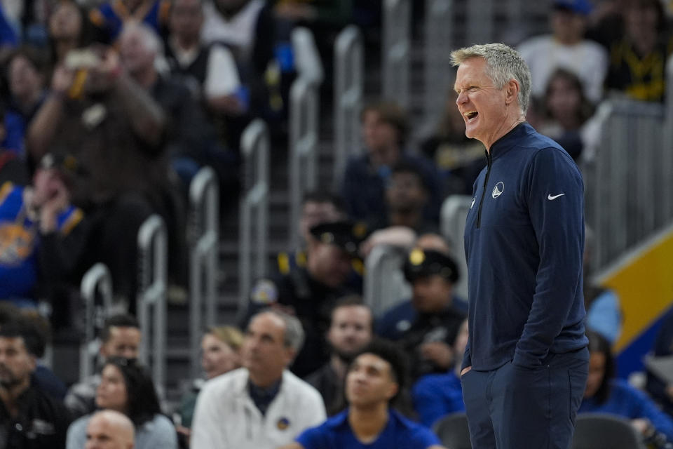 Golden State Warriors coach Steve Kerr reacts during the first half of the team's NBA basketball game against the Charlotte Hornets, Friday, Feb. 23, 2024, in San Francisco. (AP Photo/Godofredo A. Vásquez)