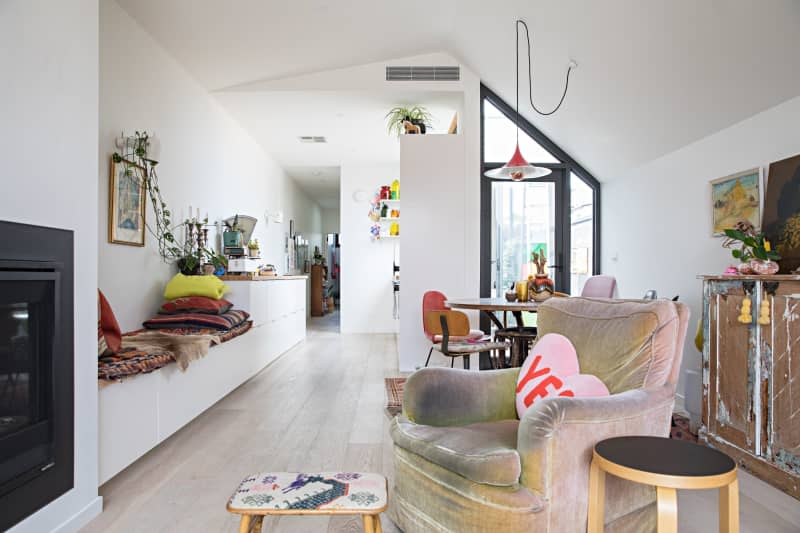 angled ceiling, built in bench seating, arm chair fireplace