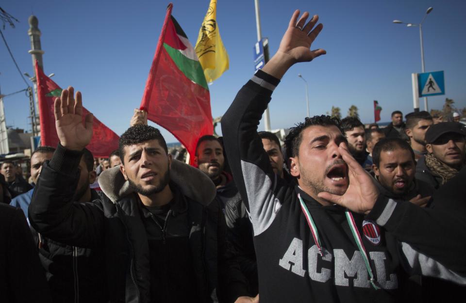 Palestinians chant angry slogans as they attend a symbolic funeral of a missing fisherman, Mohammed Al-Hissi, 33, in Gaza City, Saturday, Jan. 7, 2017. The family of a Palestinian fisherman who disappeared after a boat collision with an Israeli navy vessel off Gaza coast declared him dead Saturday after three days of search, accusing the Israeli military of deliberately sinking the fishing boat. (AP Photo/Khalil Hamra)