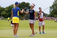 Aug 20, 2017; West Des Moines, IA, USA; Europe golfer Anna Nordqvist and USA golfer Lexi Thompson shake hands on the 18th green during the final round of The Solheim Cup international golf tournament at Des Moines Golf and Country Club. Brian Spurlock-USA TODAY Sports