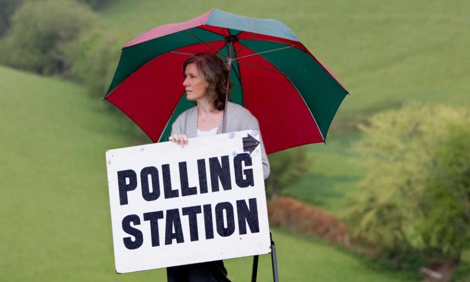 Residing Polling officer Sharon Gullick outside rural polling station at Shirwell in North Devon during election time, UK