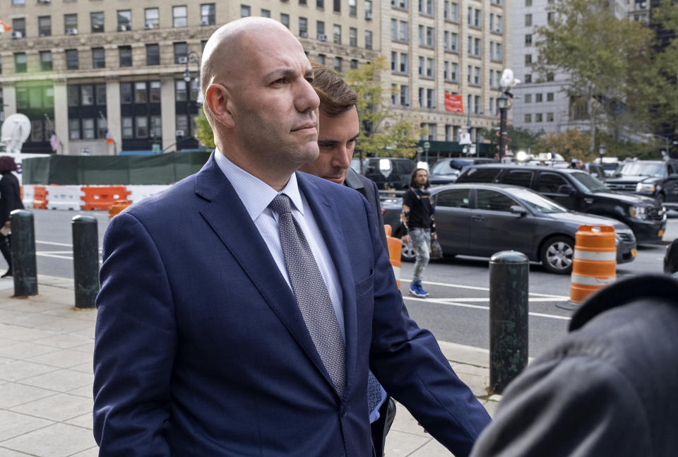 David Correia, center, leaves federal court, Thursday, Oct. 17, 2019, in New York. Correia and Andrey Kukushkin pleaded not guilty Thursday to conspiring with associates of Rudy Giuliani to make illegal campaign contributions. They are among four men charged with using straw donors to make illegal contributions to politicians they thought could help their political and business interests. (AP Photo/Craig Ruttle)