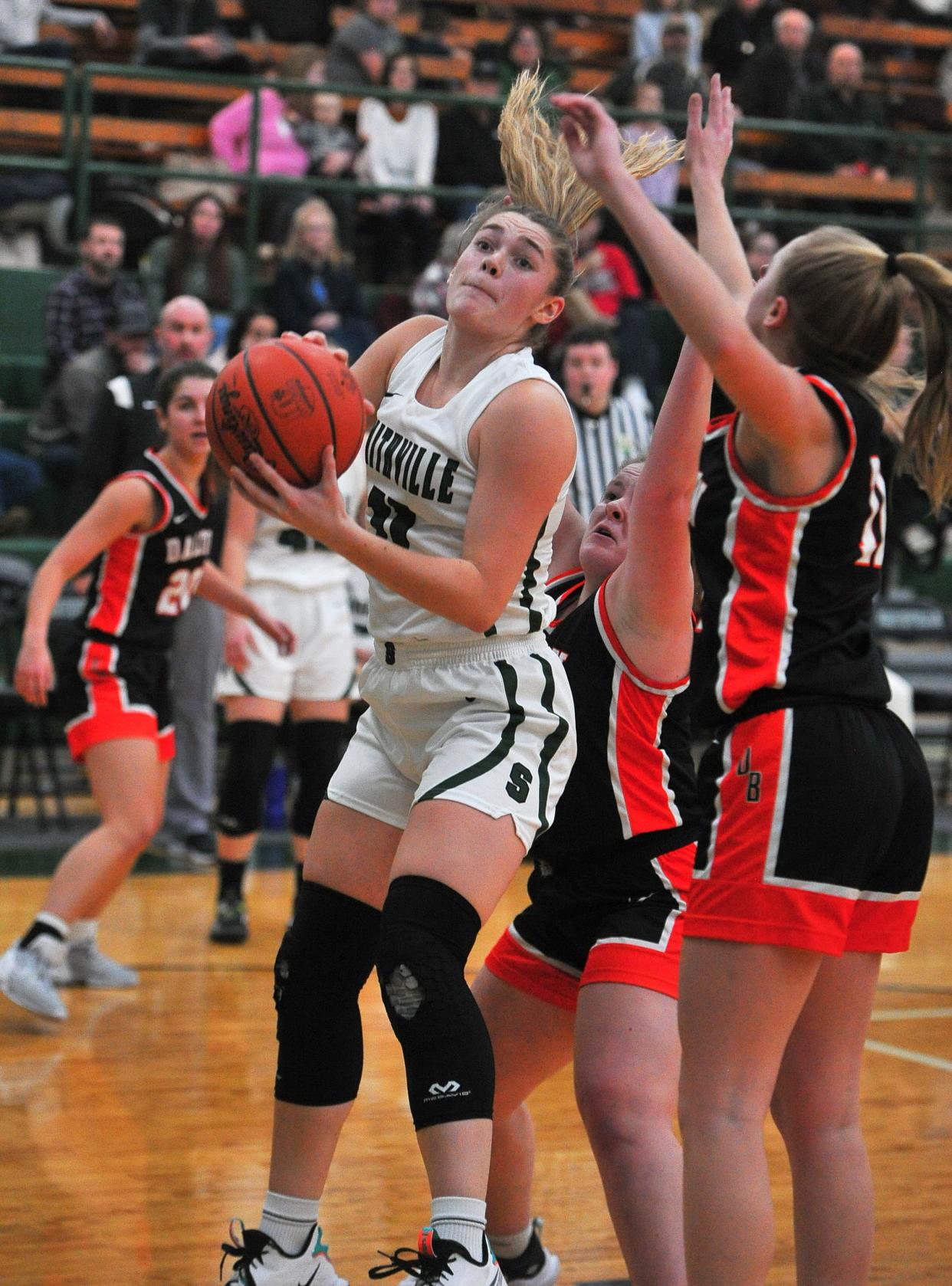 Smithville's Naomi Kelb gets an offensive rebound.