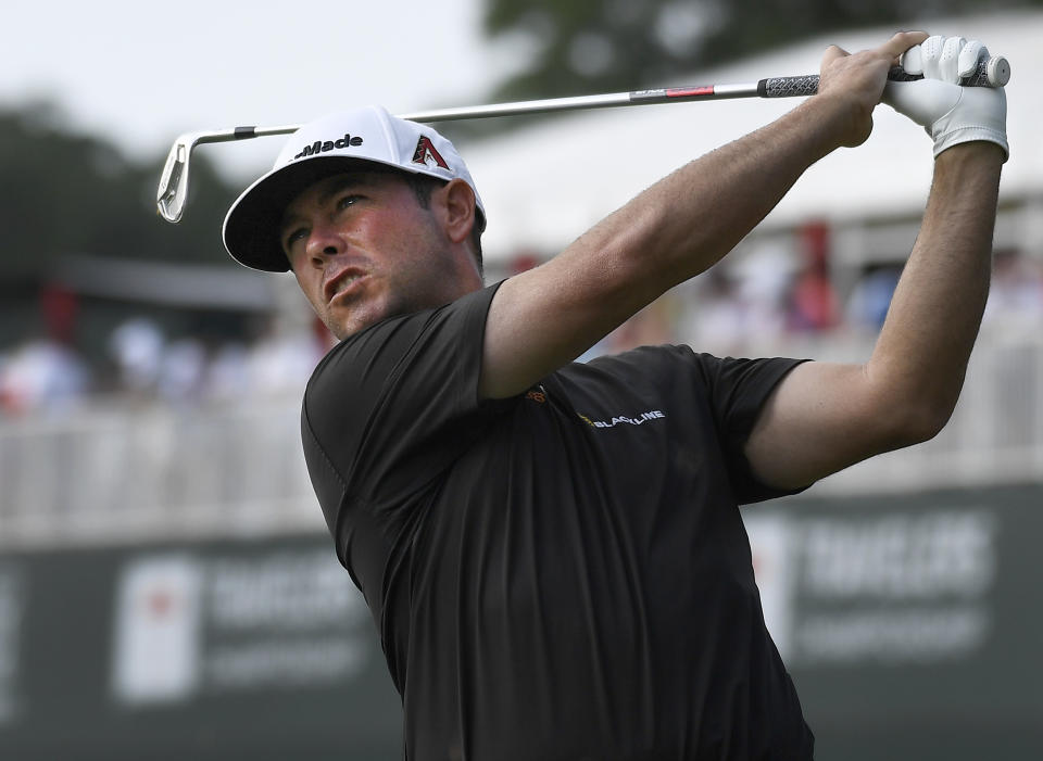 Chez Reavie hits off the 16th tee during the third round of the Travelers Championship golf tournament Saturday, June 22, 2019, in Cromwell, Conn. (AP Photo/Jessica Hill)