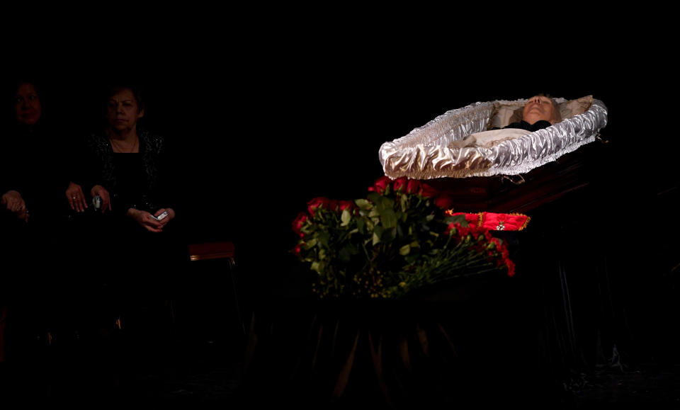 People gather to pay their last respects to Lyudmila Alexeyeva, the Moscow Helsinki Group Chair and human rights activist during a farewell ceremony in Moscow, Russia, Tuesday, Dec. 11, 2018. A Russian rights official says Lyudmila Alexeyeva, who was forced into exile by Soviet authorities after founding Russia's oldest human rights organization in 1976, has died in a Moscow hospital at 91 it was reported on Saturday, Dec. 8, 2018. (Alexander Nemenov/Pool Photo via AP)