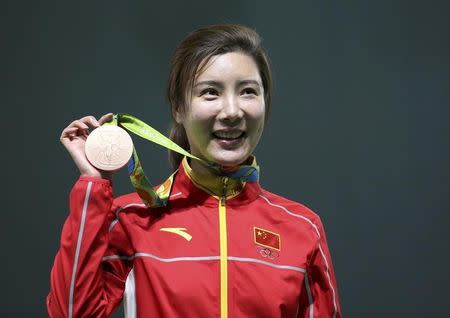 2016 Rio Olympics - Shooting - Victory Ceremony - Women's 50m Rifle 3 Positions Victory Ceremony - Olympic Shooting Centre - Rio de Janeiro, Brazil - 11/08/2016. Du Li (CHN) of China pose with her bronze medal. REUTERS/Edgard Garrido