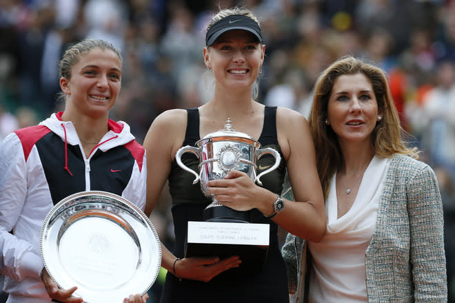 Russia's Maria Sharapova (C) and Italy's Sara Errani hold their trophies Former tennis champion Monica Seles (R) on the podium after their Women's Singles final tennis match of the French Open tennis tournament at the Roland Garros stadium, on June 9, 2012 in Paris. Sharapova won the final. AFP PHOTO / JACQUES DEMARTHONJACQUES DEMARTHON/AFP/GettyImages