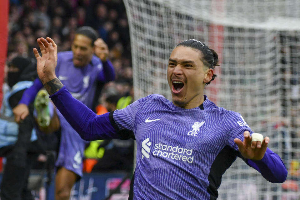 Liverpool's Darwin Nunez celebrates after scoring his side's opening goal during the English Premier League soccer match between Nottingham Forest and Liverpool at City ground in Nottingham, England, Saturday, March 2, 2024. (AP Photo/Rui Vieira)