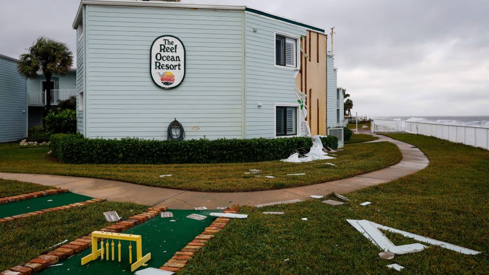 Siding hangs from building in November 2022 at The Reef Ocean Resort in Vero Beach, Florida, after Hurricane Nicole made landfall. - Eva Marie Uzcategui/AFP/Getty Images