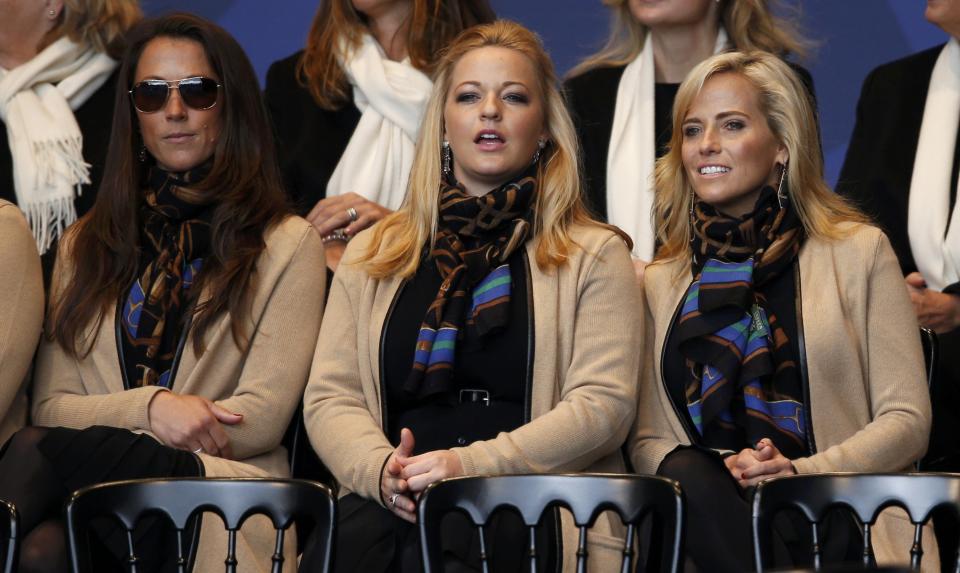 (L-R) Wives and partners Sybi Kuchar, Kandi Mahan and Amy Mickelson of U.S. Team players, sit together for the opening ceremony of the 40th Ryder Cup at Gleneagles in Scotland September 25, 2014. REUTERS/Russell Cheyne (BRITAIN - Tags: SPORT GOLF)