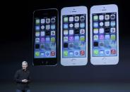 Apple Inc CEO Tim Cook speaks on stage during an Apple event in San Francisco, California October 22, 2013. REUTERS/Robert Galbraith (UNITED STATES - Tags: BUSINESS TELECOMS SCIENCE TECHNOLOGY)