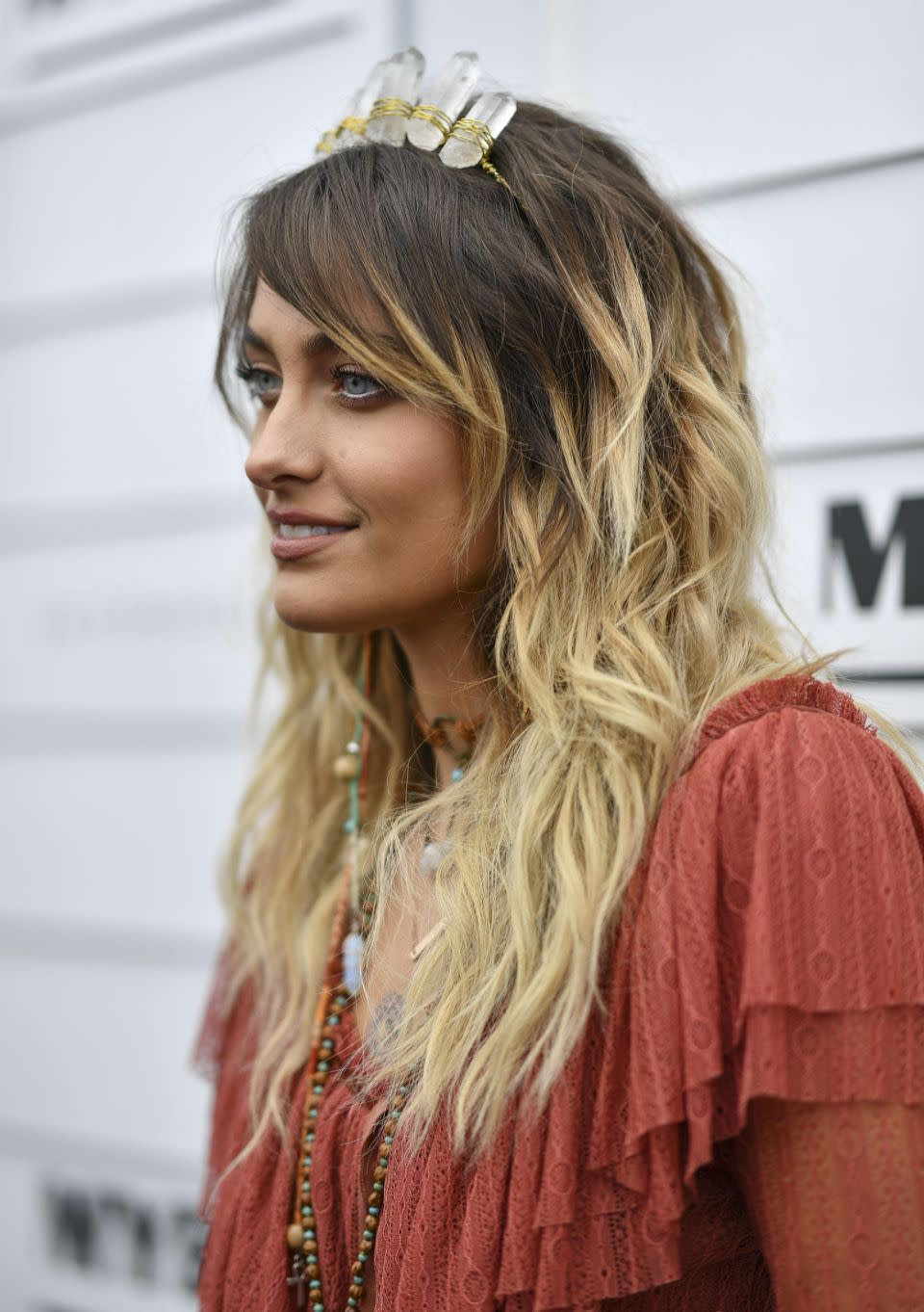 Her crystal crown has drawn attention for it's unusual place amongst the traditional racegoers style. Source: Media Mode