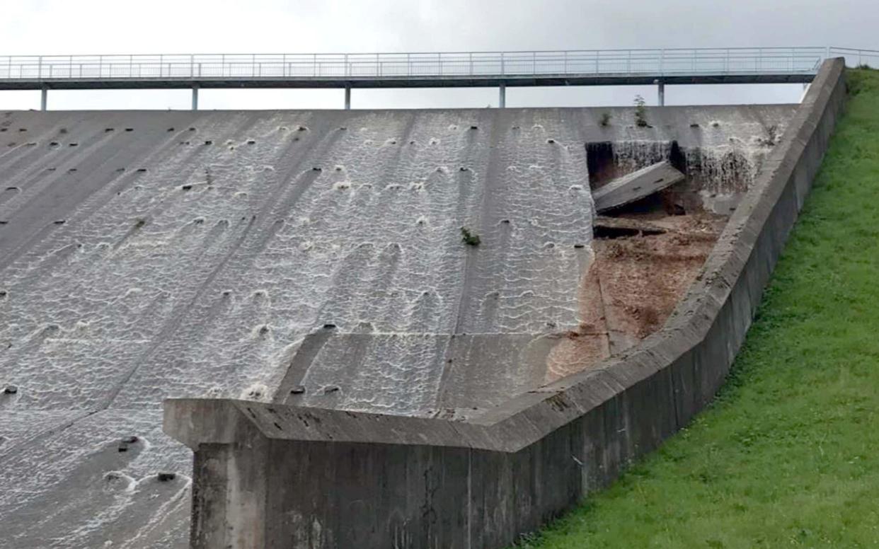  A badly damaged dam wall at Toddbrook Reservoir in Whaley Bridge  - PA