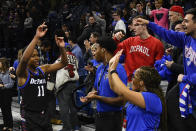 DePaul guard Charlie Moore (11) greets fans after an NCAA college basketball game against Butler Saturday, Jan. 18, 2020, in Chicago. DePaul won 79-66. (AP Photo/Matt Marton)