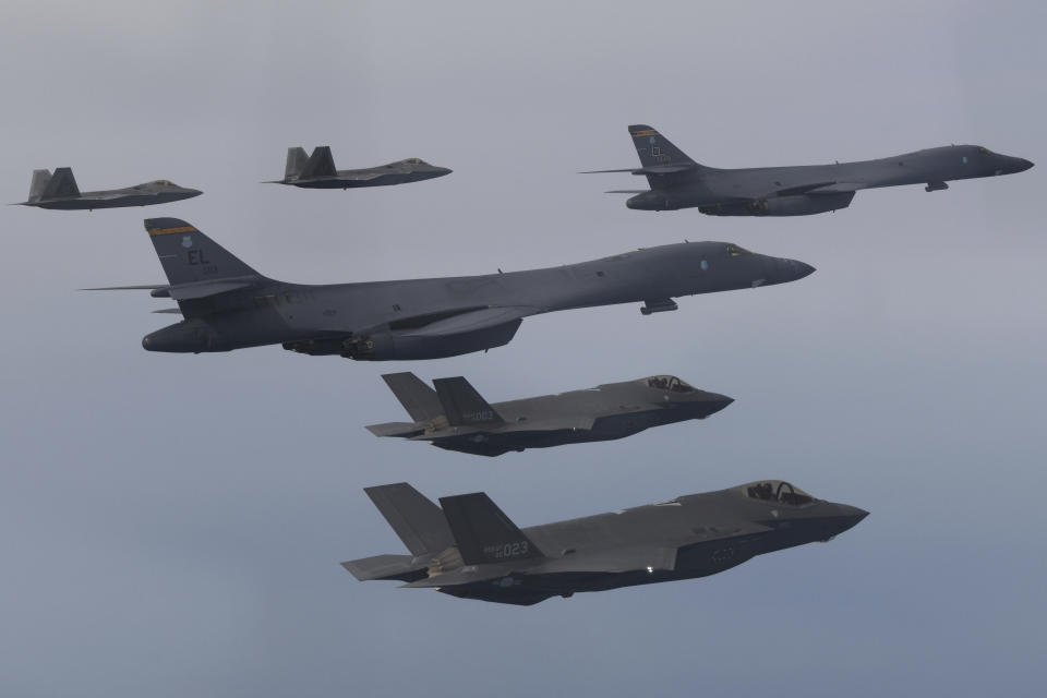 FILE - In this photo provided by South Korean Defense Ministry, U.S. Air Force B-1B bombers, center, F-22 fighter jets and South Korean Air Force F-35 fighter jets, bottom, fly over South Korea Peninsula during a joint air drill in South Korea, on Jan. 1, 2023. South Korean and U.S. militaries will hold a table-top exercise at the Pentagon next week to hone their joint response to a potential use of nuclear weapons by North Korea, Seoul officials said Friday, Feb. 17, 2023. (South Korean Defense Ministry via AP, File)